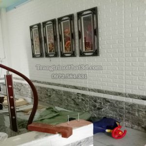 thiet ke phong khach voi xop dan tuong 3d gia gach trang va van da den