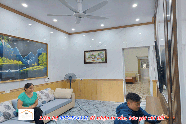 thi cong nhua op tuong pvc van da cho phong khach